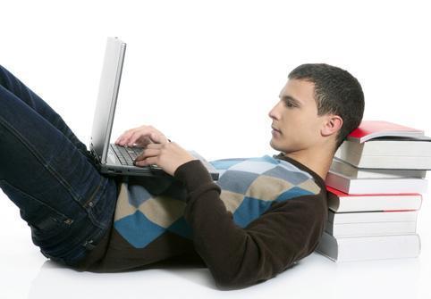 Male-on-laptop-laying-down-Featured.jpg