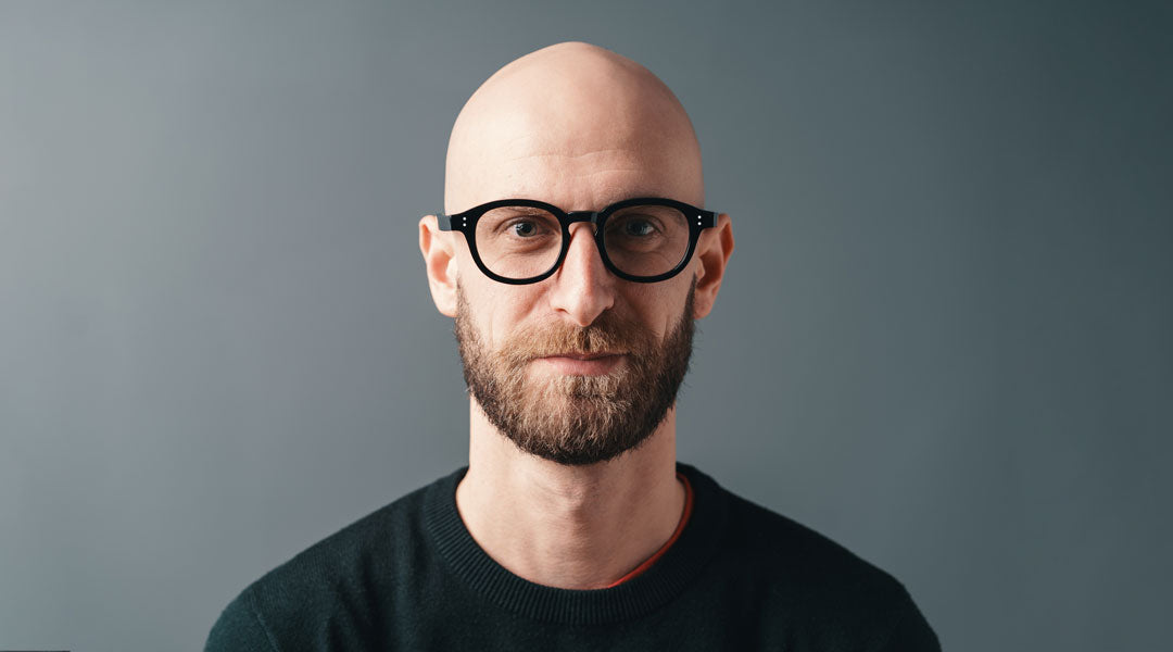 Bald-man-wearing-black-glasses-frame.jpg